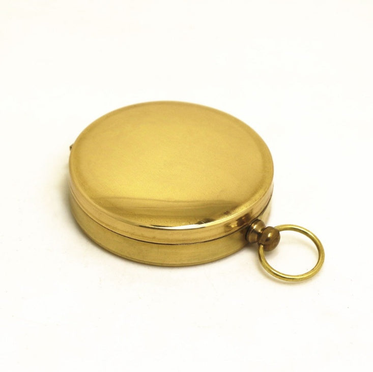 Classic gold-tone pocket compass for hiking and camping